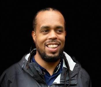 image of male smiling with black background 