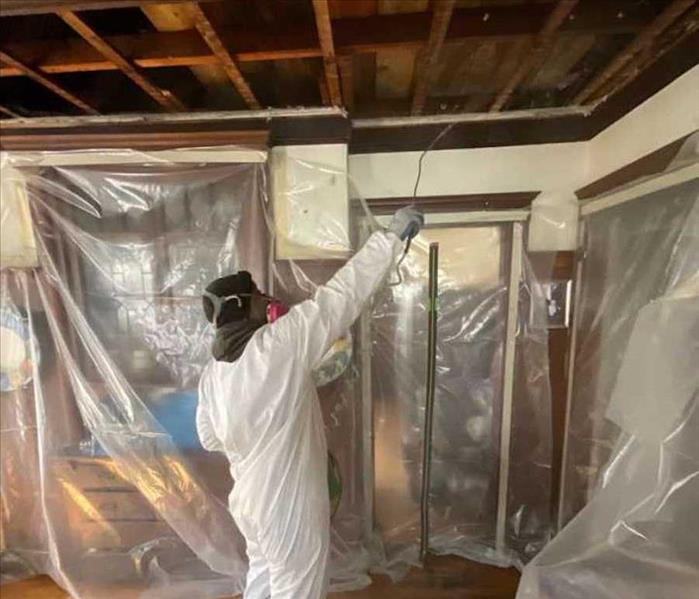 SERVPRO tech spraying for mold